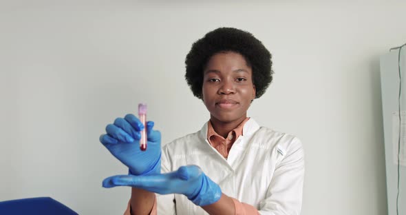 Female African Scientist Doctor Doing Blood Test in Laboratory