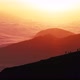 Silhouettes Walk on Mountain Crest Against Hills at Sunset - VideoHive Item for Sale