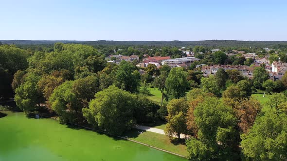 Aerial View of Medieval Landmark Royal Hunting Castle Fontainbleau and Lake with White Swans, France