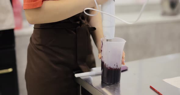 Chef Chopped Boiled Currants in a Blender Making Jam