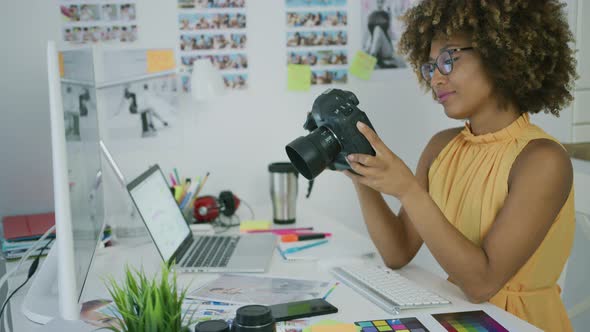 Young Woman Exploring Photos on Camera