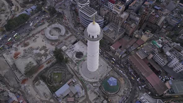 Flying up and over the Dharahara Tower looking down at it