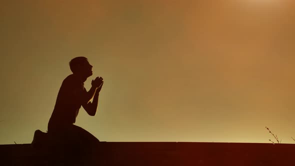 Man Falls To His Knees and Prays