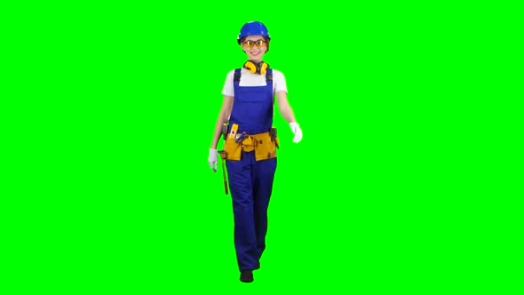 Brigadier Girl in a Helmet and White Gloves Walks and Waving Greetings. Green Screen