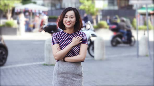 Portrait of smiling chinese woman alone , outdoor