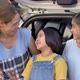 Slow motion Happy family sitting on the car front of home - VideoHive Item for Sale