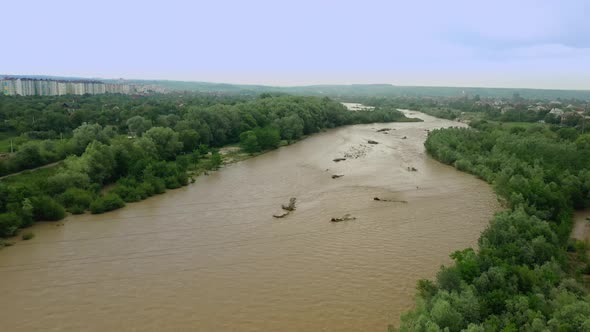 Aerial Drone View. Rriver Water Big and Dirty After Heavy Rain. Slow Motion. Wide View