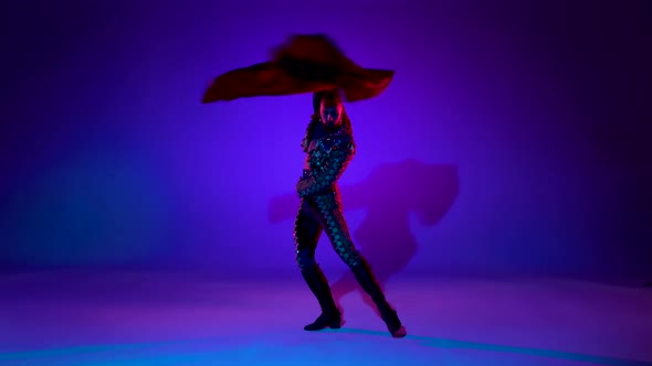 Torero in Blue and Gold Suit or Typical Spanish Bullfighter Isolated Over on a Blue Background