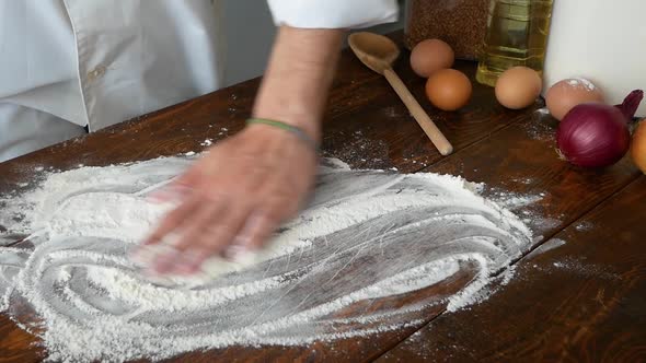 Closeup of Baker Pours Flour in Kitchen