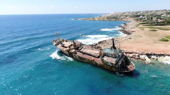 Flying Over Coastline with Broken Ship