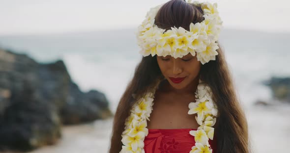 Woman performing Hawaiian hula on the beach