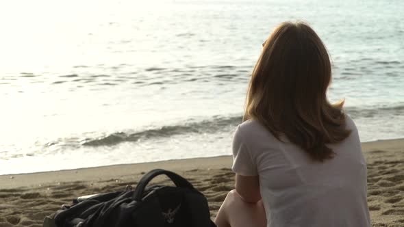 Girl Sitting By the Sea on the Sand in Alanya, Turkey