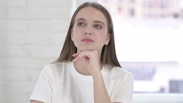 Portrait of Thoughtful Young Woman Thinking