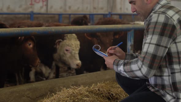 Farmer taking notes at the Fattening Farm.