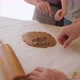 Little Boy Cutting Biscuits Out of Dough in Kitchen with Parents - VideoHive Item for Sale