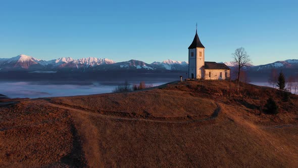 Church of St. Primoz and Felicijan on Sunny Day. Julian Alps. Jamnik, Slovenia