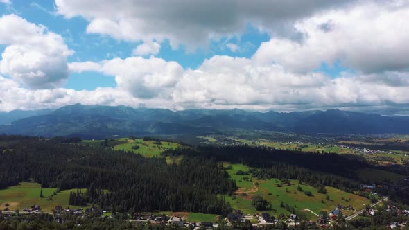 Flight Over a Mountain Cottage Village in Poland, Zakopany, Tatra National Park Aerial 4K Video