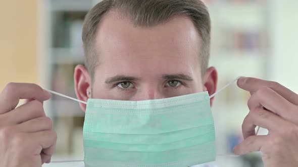Close Up of Young Doctor Wearing Face Mask