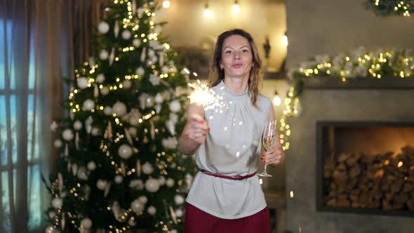 Happy New Year Holidays Adult Lady is Dancing in Decorated Room with Christmas Tree