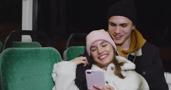 Attractive Young Girl Leaning on Her Boyfriend While They Going on Public Transport. Lovely