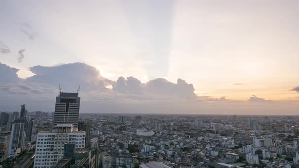 Time lapse of cloudement over Bangkok cityscape during golden hour