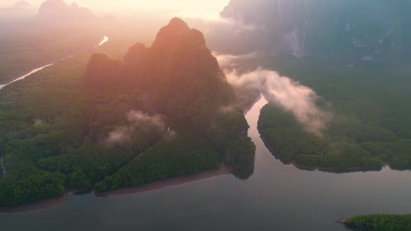 4K : Drone flying above the clouds, Limestone mountains with mangrove