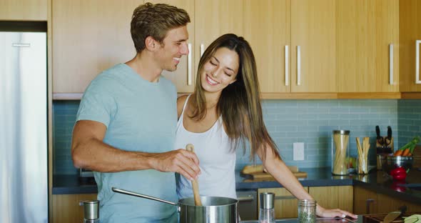 Happy Couple Cooking Together