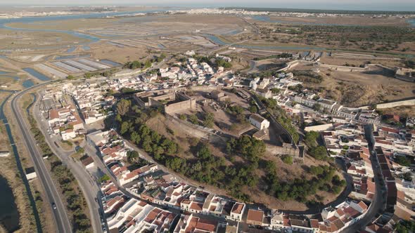 Aerial panning shot, ruins of an old fortification and castle in Castro Marim in Portugal.
