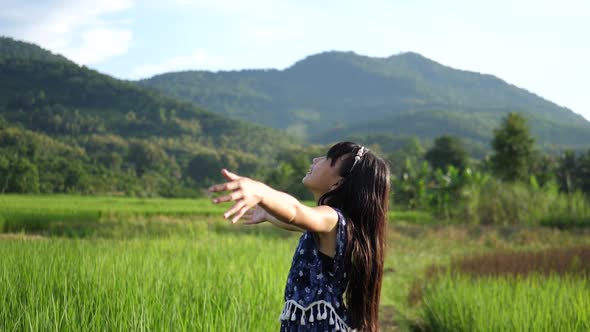 Little Girl Open Arms In Rice Field