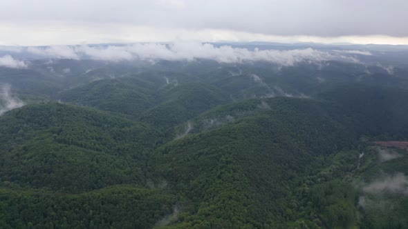 Drone flight over green mountain slopes