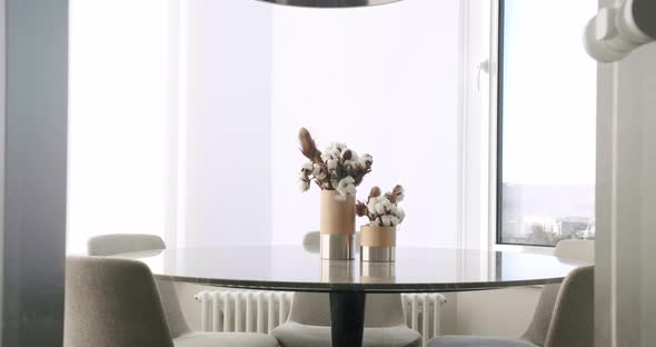 Minimalist Modern White Dining Room with White Chairs and Minimalist Lamp