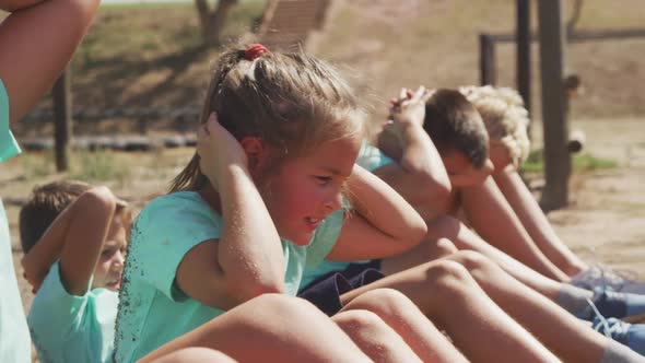 Group of Caucasian children training at boot camp