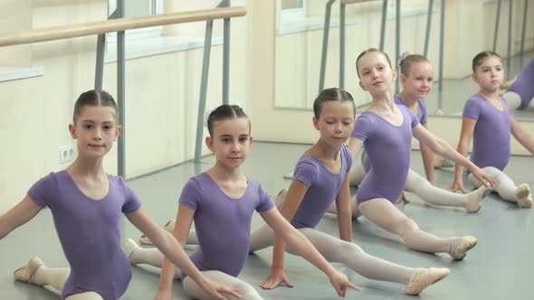 Group of Ballet Girls Doing Split at Dance Studio