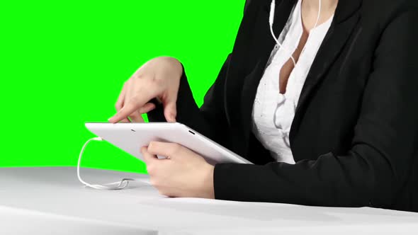 Businesswoman Using Laptop and Headset. Green Screen