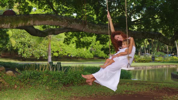 Walk in a Green Park on a Rope Swing