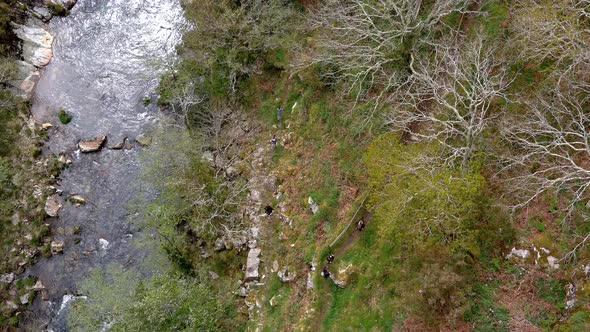 Aerial bird's eye view over hiking trail beside Sor river by the viewpoint of Aguas Caídas, Manón, L