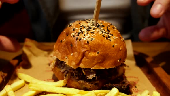 Man Hands Taking Burger Close Up