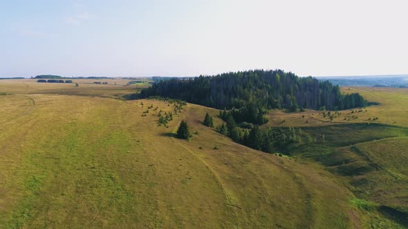 Aerial Flight over Fields and Hills - Drone Footage