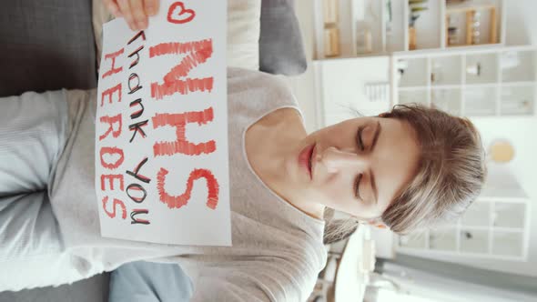 Vertical Shot of Woman Saying Thanks to NHS while Staying at Home