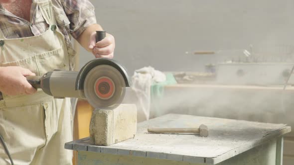 Man Working with a Manual Cutting Tool