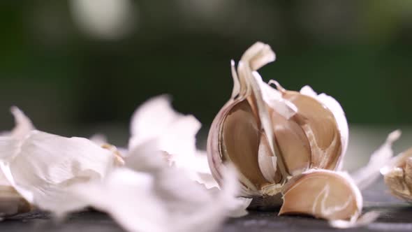 Whole Garlic Bulbs and Garlic Skin Is Blown Away. Slow Motion.