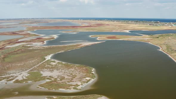 Beautiful flight in summer over salt lakes. Dry lakes. Green grass.