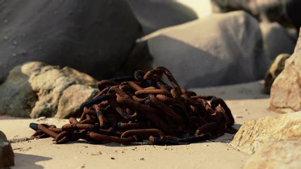 Old Rusted Chain in the Sand