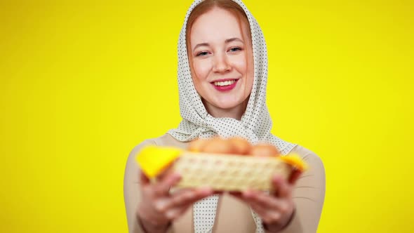Rack Focus Smiling Young Redhead Woman in Kerchief Stretching Eggs To Camera