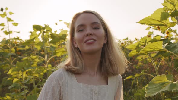 Beautiful Girl Posing For Camera In Field