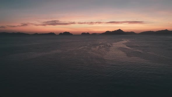 Aerial Drone View of the Sea Surface in the Light of the Golden Sunset