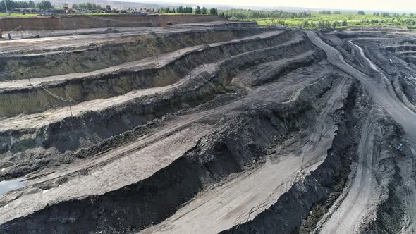 Panorama of large coal mine from the air, view of the ledges. Open Pit Anthracite Mining 