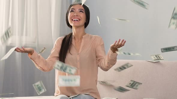 Money Falling on Happy Shopaholic Woman Enjoying Cash Back Service, Slow Motion