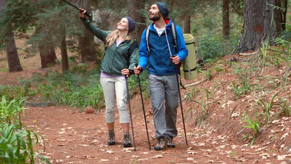 Hiker couple hiking in forest