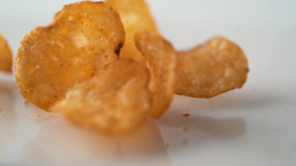 Potato chips falling. Slow Motion.